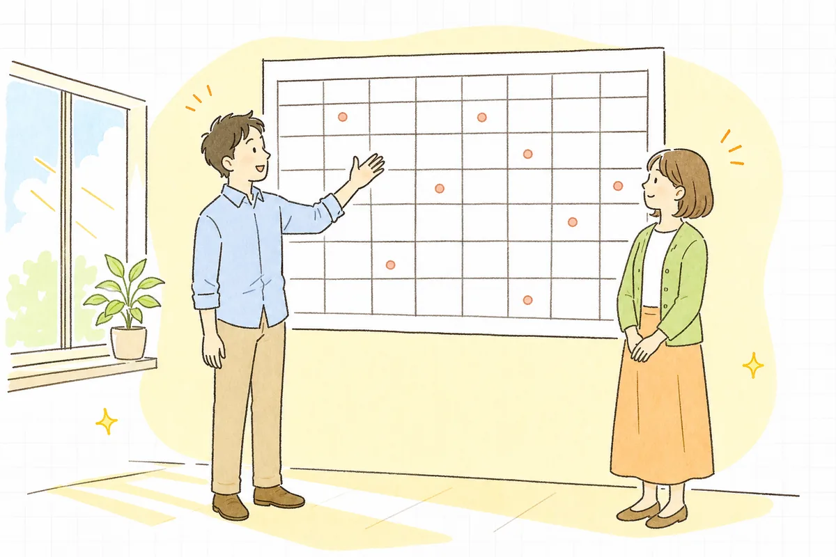 壁に貼った1枚の年間予定表の前で、同僚と一緒にそれを見上げながら穏やかに話している企業のWEB担当者